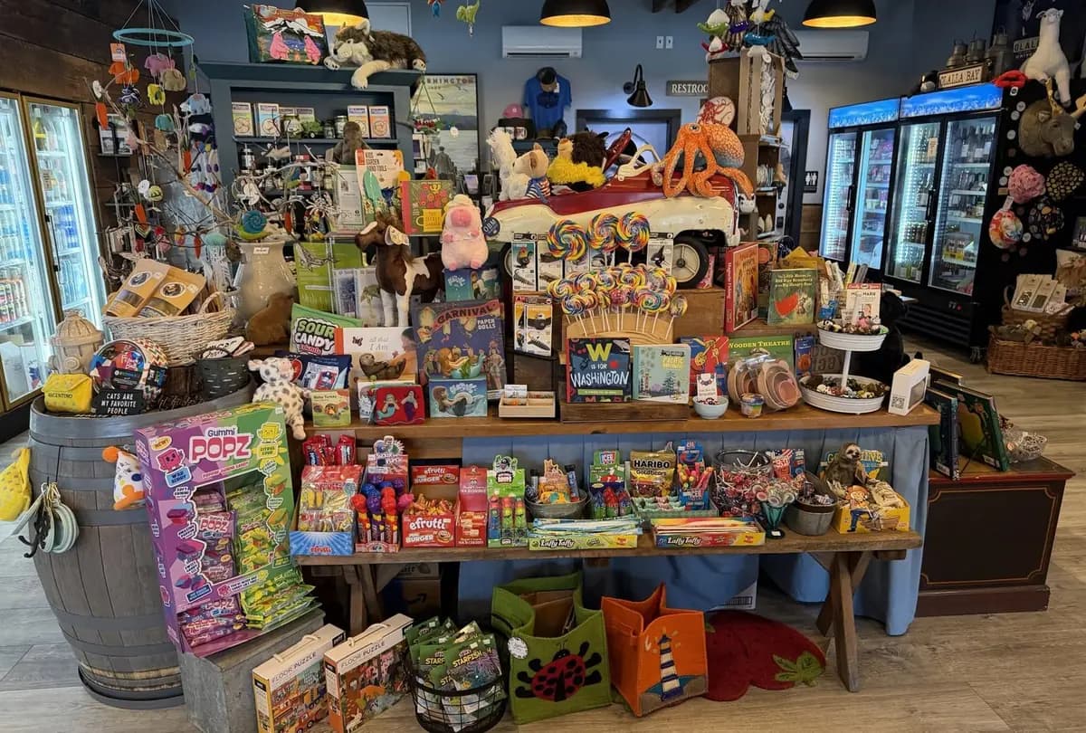 A table piled with candy, kids' books, stuffed animals and Washington souvenirs
