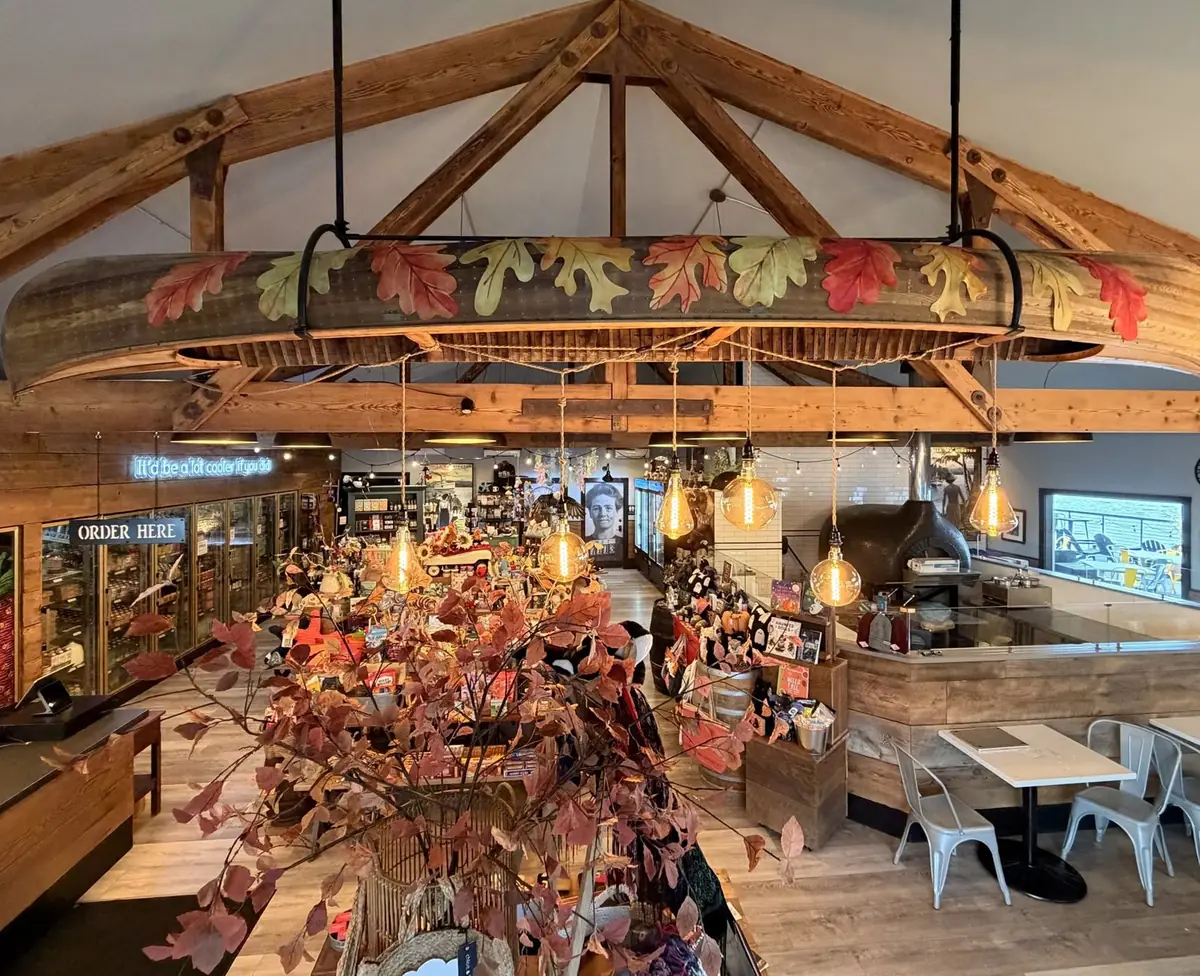 Inside the market: timber trusses, a canoe chandelier, gift tables and the pizza oven